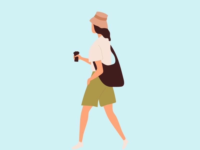 帽子をかぶりコーヒーを手に歩く女性のイラスト
