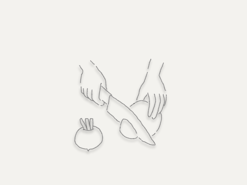 白くてやわらかいかぶを包丁で切っている様子