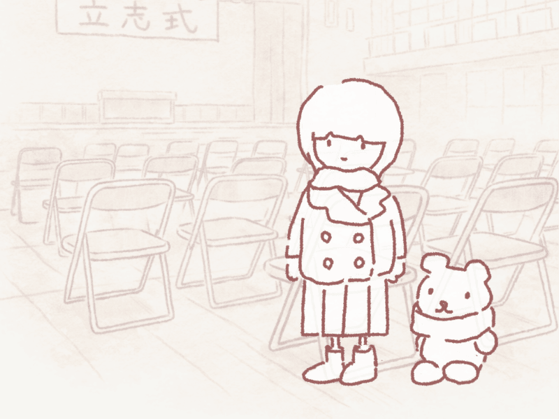 体育館に椅子が並ぶ中学の立志式で、マフラーを巻いた女の子とソラベアが前を見つめて立っているイラスト

